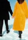 Happy walking couple. In love man and woman walking on the snowy ice. Winter vacation concept. Royalty Free Stock Photo