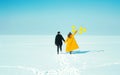 Happy walking couple. In love man and woman walking on the snowy ice. Winter vacation concept. Royalty Free Stock Photo