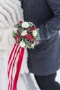 Happy wedding couple with bouquet outdoors on winter day, closeup Royalty Free Stock Photo