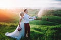 Happy wedding couple with buttle of champaine Royalty Free Stock Photo