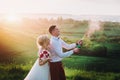 Happy wedding couple with buttle of champaine Royalty Free Stock Photo