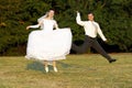 Happy wedding couple Ã¯Â¿Â½ jump Royalty Free Stock Photo