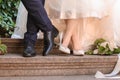 Happy wedding couple on stairs outdoors