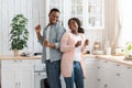 Happy Weekend. Portrait Of Cheerful African American Spouses Dancing In Kitchen Royalty Free Stock Photo