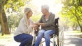 Happy, wheelchair and a mother and woman in a park for support, bonding and talking. Smile, family love and an elderly Royalty Free Stock Photo