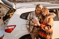 Happy white couple taking selfie photo by car while walking at seashore Royalty Free Stock Photo