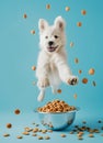Happy white dog puppy jumping on a bowl full of flying kibble