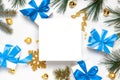 Happy 2021. White gift box with blue ribbon, New Year balls and Christmas tree in xmas composition on white background for Royalty Free Stock Photo