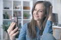 Happy white woman smiling, using phone, having video call, video chatting. Royalty Free Stock Photo