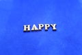 Happy white wooden letters on blue background Royalty Free Stock Photo