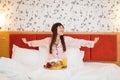 Happy wife having breakfast with rose in bed Royalty Free Stock Photo