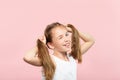 Happy wink adolescent girl pig tails hair carefree Royalty Free Stock Photo