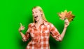 Happy winking girl with autumn leaves. Autumn vogue trends. Autumn foliage. Autumn woman playing with maple leafs. Happy