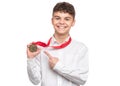 Teen boy with medal