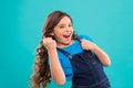 Happy winner. Successful happy kid. Achieve success. Kid cheerful celebrate victory. Girl cute child long curly hair Royalty Free Stock Photo