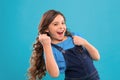 Happy winner. Successful happy kid. Achieve success. Kid cheerful celebrate victory. Girl cute child long curly hair Royalty Free Stock Photo