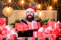 Happy winter holidays. Lot of gifts. Hipster prepared gifts for family. Man santa claus hat celebrate new year. Generous