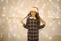 Happy winter holidays. Small girl at home garland lights. Kid relaxing cozy garland. New year. Santa claus. Little girl Royalty Free Stock Photo