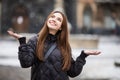 Happy winter time in big city of charming girl walking on street Royalty Free Stock Photo