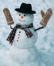 Happy winter time. Christmas snowman on white snow background. Snowman with light star in Christmas day. Royalty Free Stock Photo