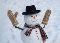 Happy winter time. Christmas snowman on white snow background. Snowman with light star in Christmas day. Royalty Free Stock Photo