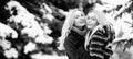 Happy winter woman friends hugging on winter snowy background outdoor. Portrait of young beautiful women couple having Royalty Free Stock Photo