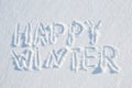 Happy winter written on snow