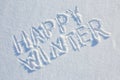 Happy winter written on snow