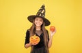 happy witch kid with pumpkin jack o lantern wear costume of wizard on halloween party, halloween atribute Royalty Free Stock Photo
