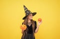 happy witch teenage girl with pumpkin jack o lantern wear costume of wizard on halloween party, halloween jack o lantern Royalty Free Stock Photo