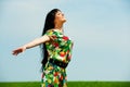 Happy woman against blue sky Royalty Free Stock Photo