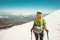 Happy Woman alpinist climbing in mountains