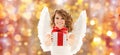 Happy woman with angel wings and christmas gift Royalty Free Stock Photo