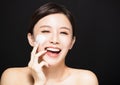 Woman applying lotion cream on face Royalty Free Stock Photo