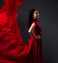 Happy woman, art and fashion, red fabric on dark background with beauty and aesthetic movement. Flowing silk, fantasy