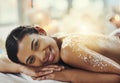 Happy woman, back or portrait at spa in salt scrub for cosmetics treatment, skincare and massage at resort. Face of Royalty Free Stock Photo