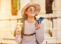 Happy woman, backpack and phone call in travel, sightseeing or city adventure and voice message, recording or coffee Royalty Free Stock Photo