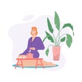 Happy woman in bathrobe drinking tea and relaxing in spa salon Royalty Free Stock Photo