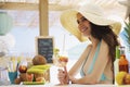 Happy woman at the beach eating a fruit salad Royalty Free Stock Photo