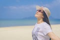 Happy woman on the beach.