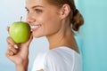 Happy Woman With Beautiful Smile, Healthy Teeth Holding Apple Royalty Free Stock Photo