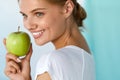 Happy Woman With Beautiful Smile, Healthy Teeth Holding Apple Royalty Free Stock Photo