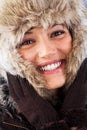 Happy woman with a beautiful smile in winter