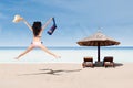 Happy woman in bikini jumping at beach Royalty Free Stock Photo