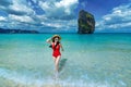 Happy woman in bikini on Poda island, Thailand.