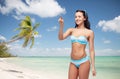 Happy woman in bikini swimsuit pointing finger Royalty Free Stock Photo