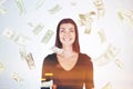 Happy woman in black, dollar bills falling Royalty Free Stock Photo