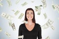 Happy woman with black hair, dollar bills falling Royalty Free Stock Photo