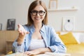 Happy woman blogger applicant teacher sit at home office look at camera doing online job interview during video chat Royalty Free Stock Photo