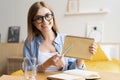 Happy woman blogger applicant teacher sit at home office look at camera doing online job interview during video chat